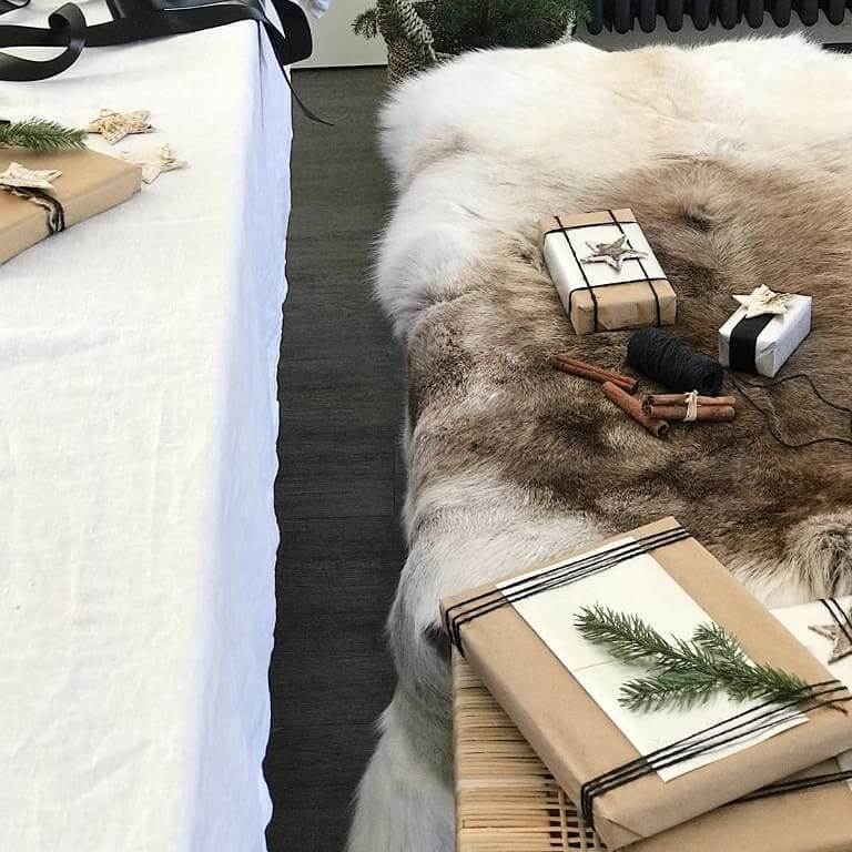Reindeer hide draped on bench with Christmas styling