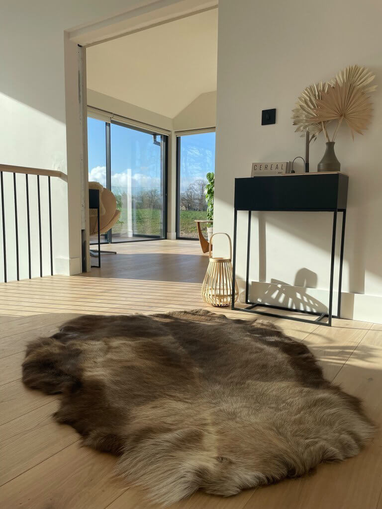 Reindeer hide on floor scandi setting