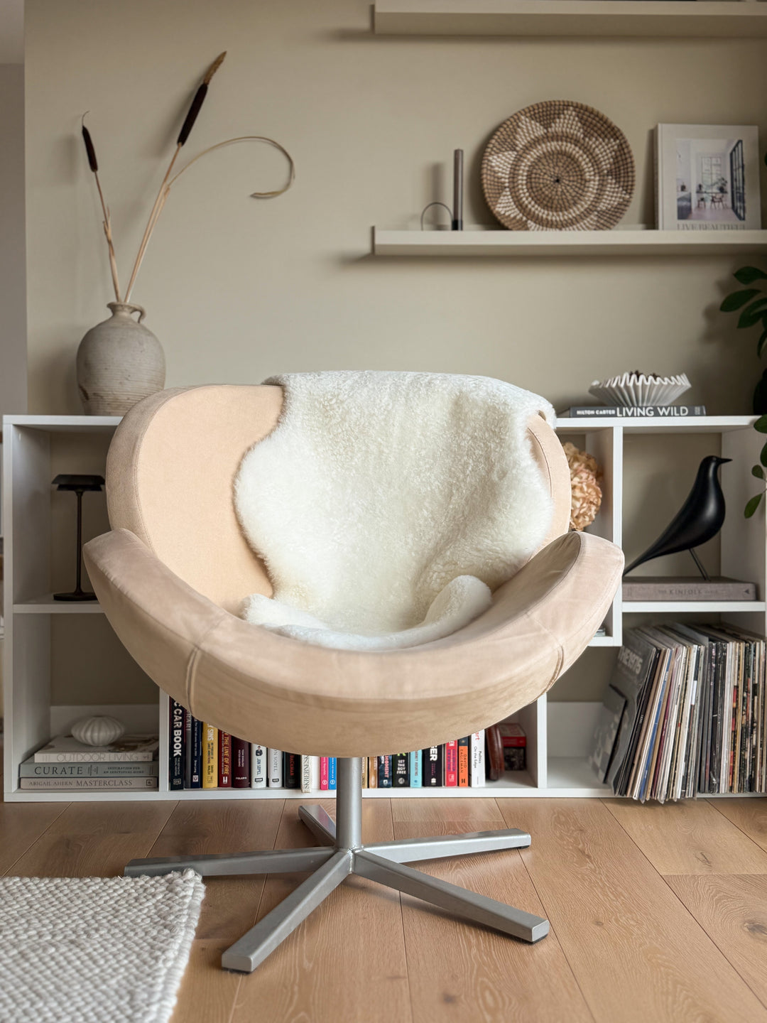 white sheepskin on a chair in a scandi setting