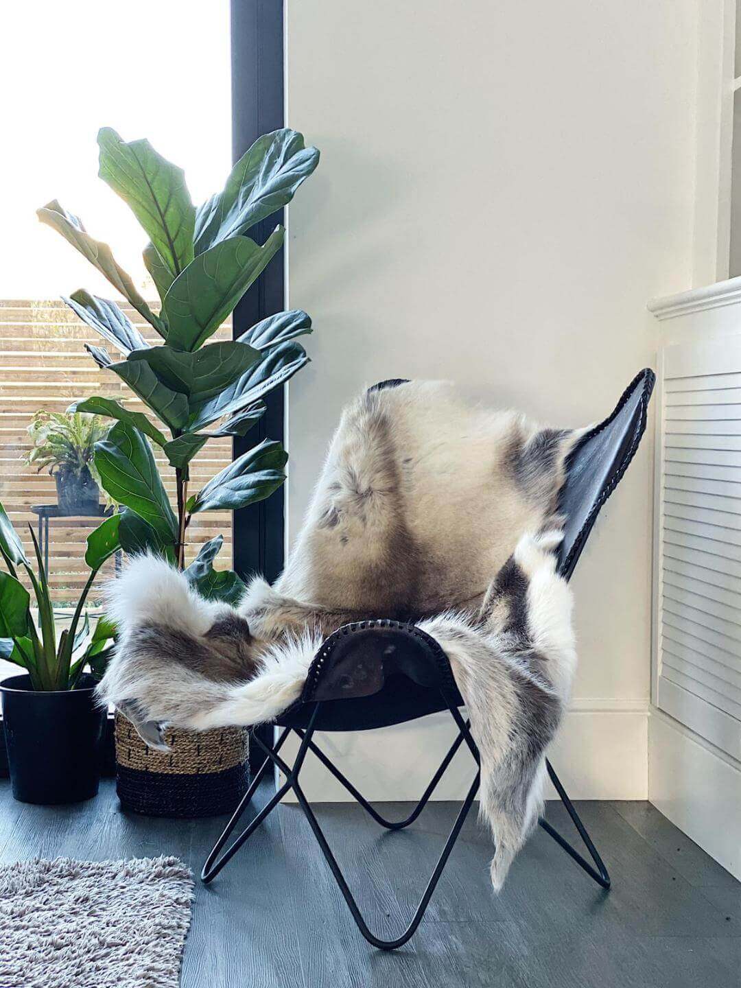 Nordic reindeer hide rug in natural brown, grey, and cream tones