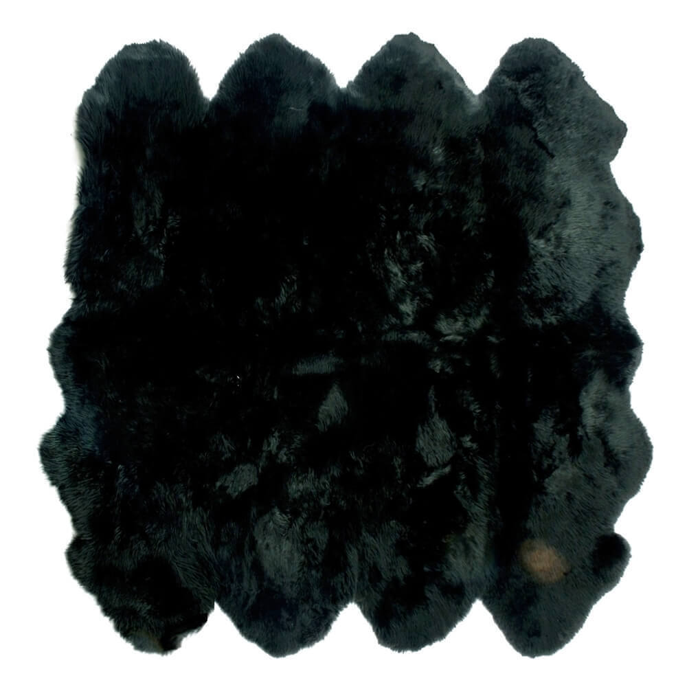 black octo sheepskin rug on a white background