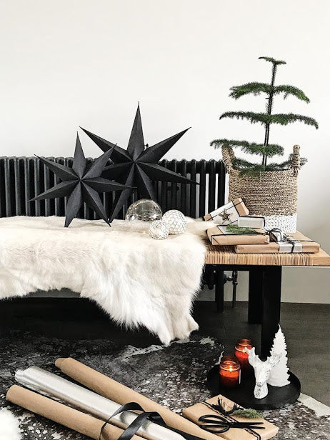 reindeer hide on bench with Christmas decorations 