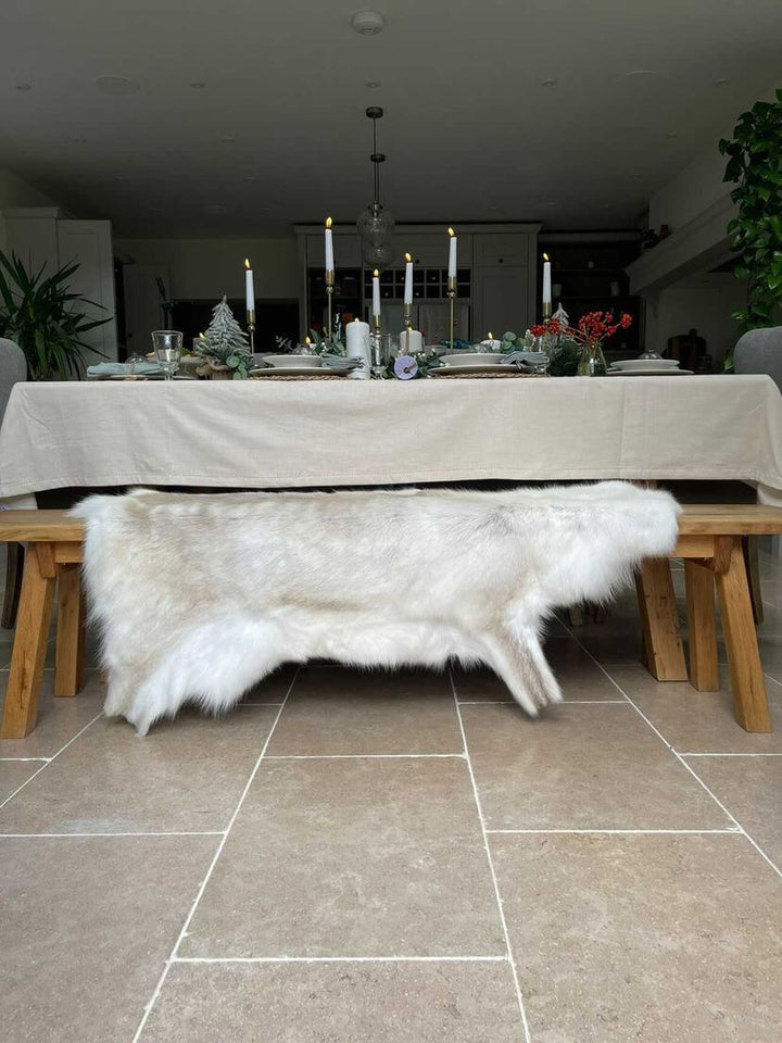 reindeer hide on bench in a Christmas setting 