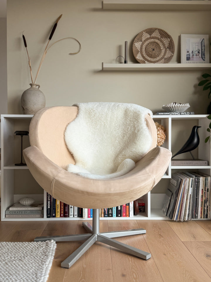white sheepskin on a chair in a scandi setting 