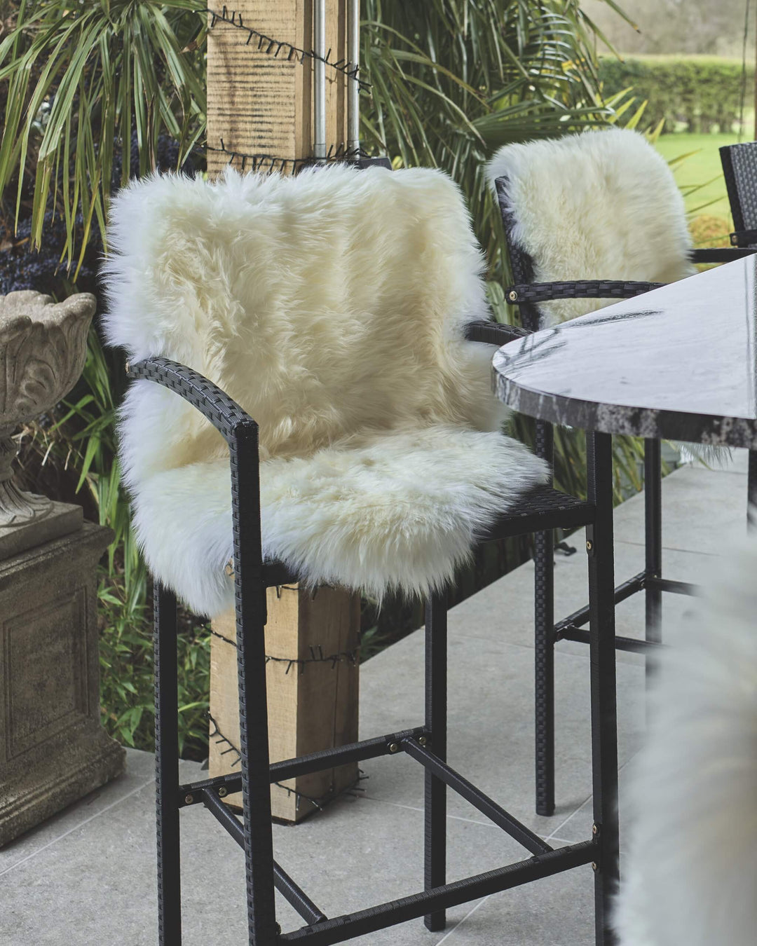 white sheepskin on a bar stool 