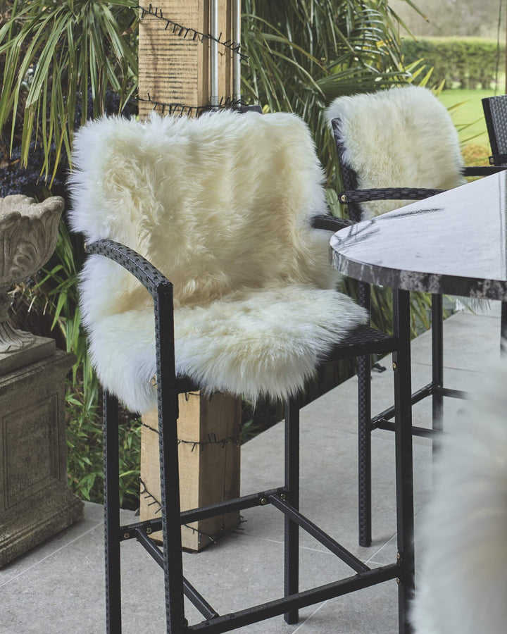 white sheepskin on a bar stool 