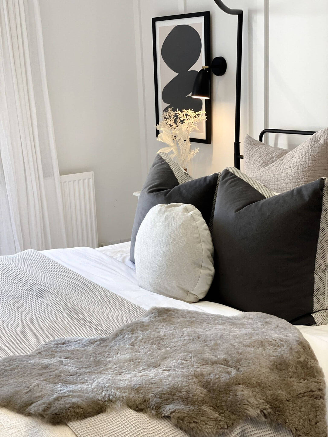 taupe sheepskin on bed 
